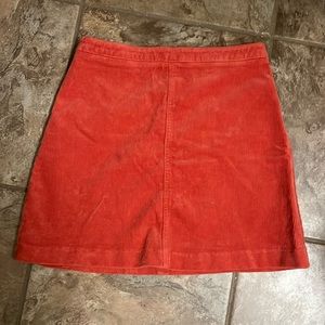 Small Forever 21 corduroy skirt. Gently used. Rustic red color.